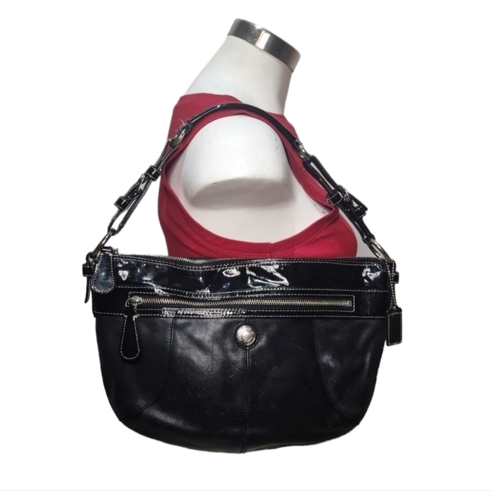Coach Leather Bag some marks inside onfabric on the outside it has tears, refer